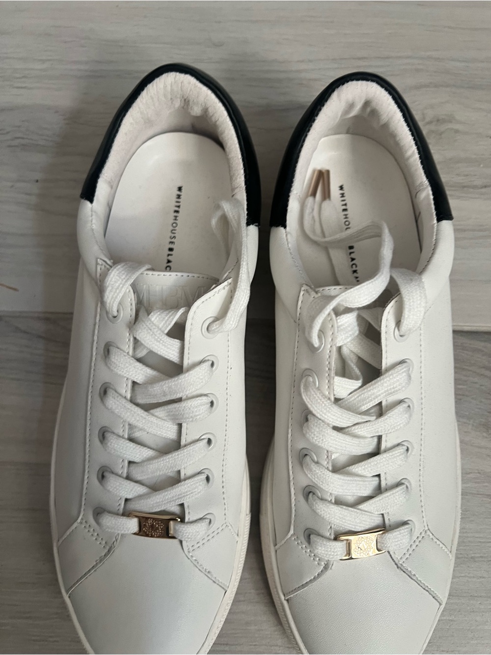 White Leather Sneakers with Black Heel Accent